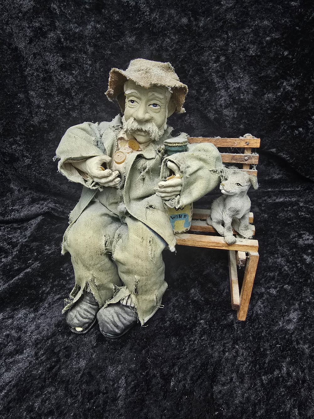 Lot 189: tramp on bench figurine