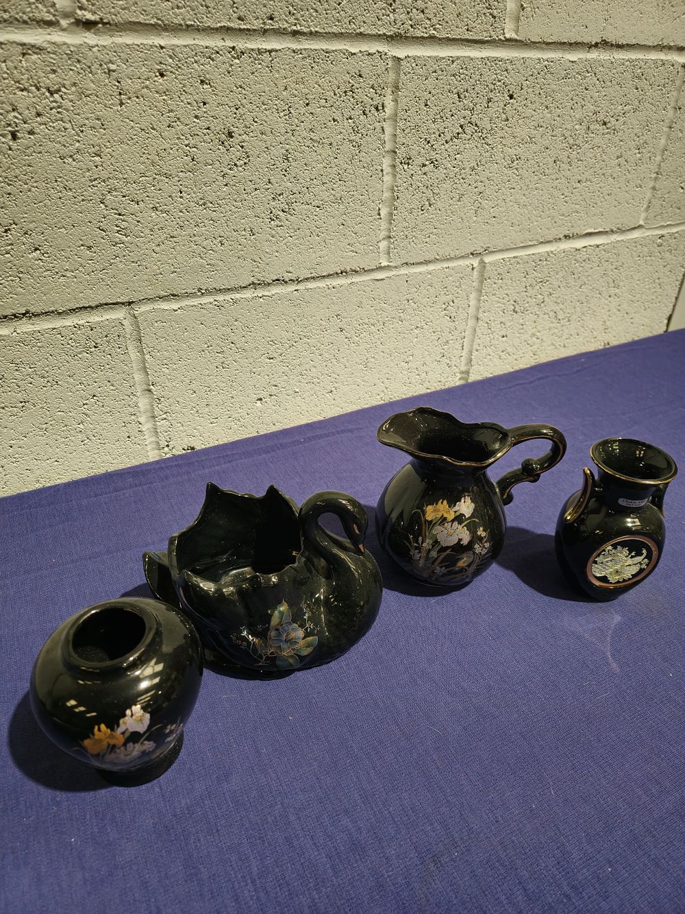 Lot 235: 1 x black pottery swan plant pot holder