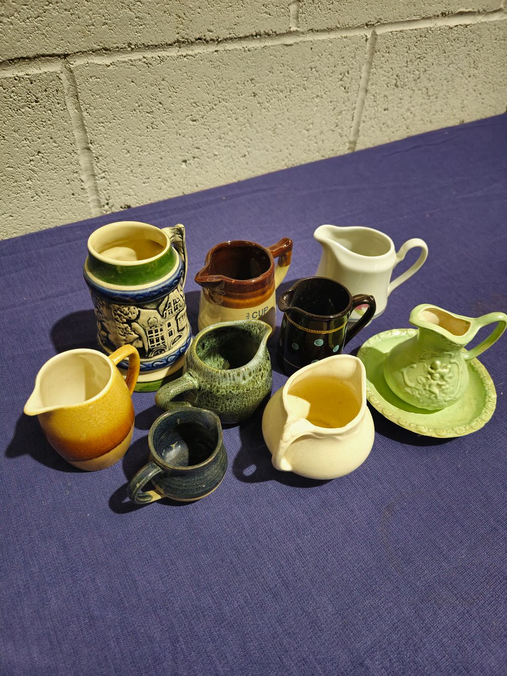 Lot 240: 8 x various small pottery jugs