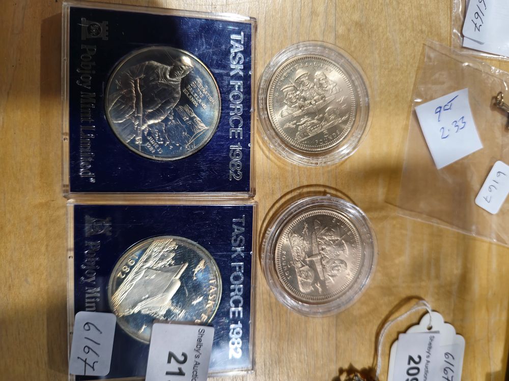 Lot 213: 2 x task force 1982 pobjoy mint crowns with 2 x d day £5 coins