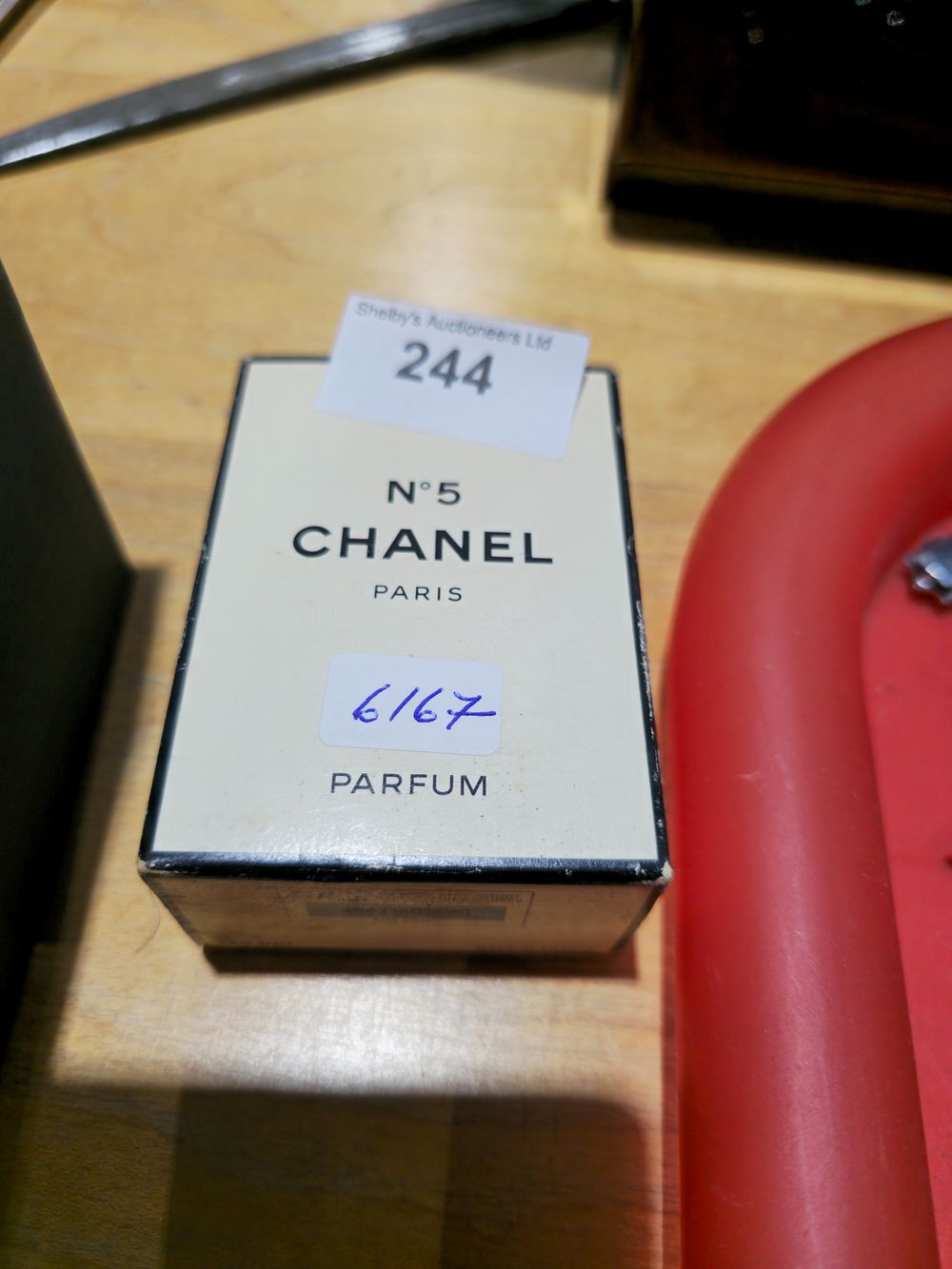 Lot 244: 14 ml bottle of chanel no5 perfume open appears to be full
