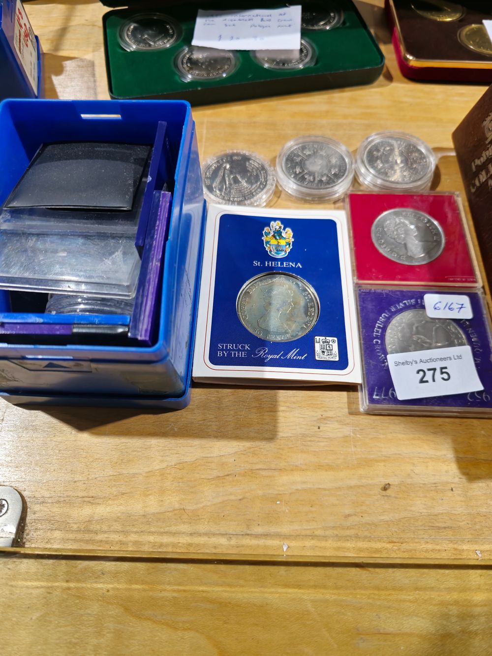 Lot 275: box of empty coin holders with 6 various crown coins
