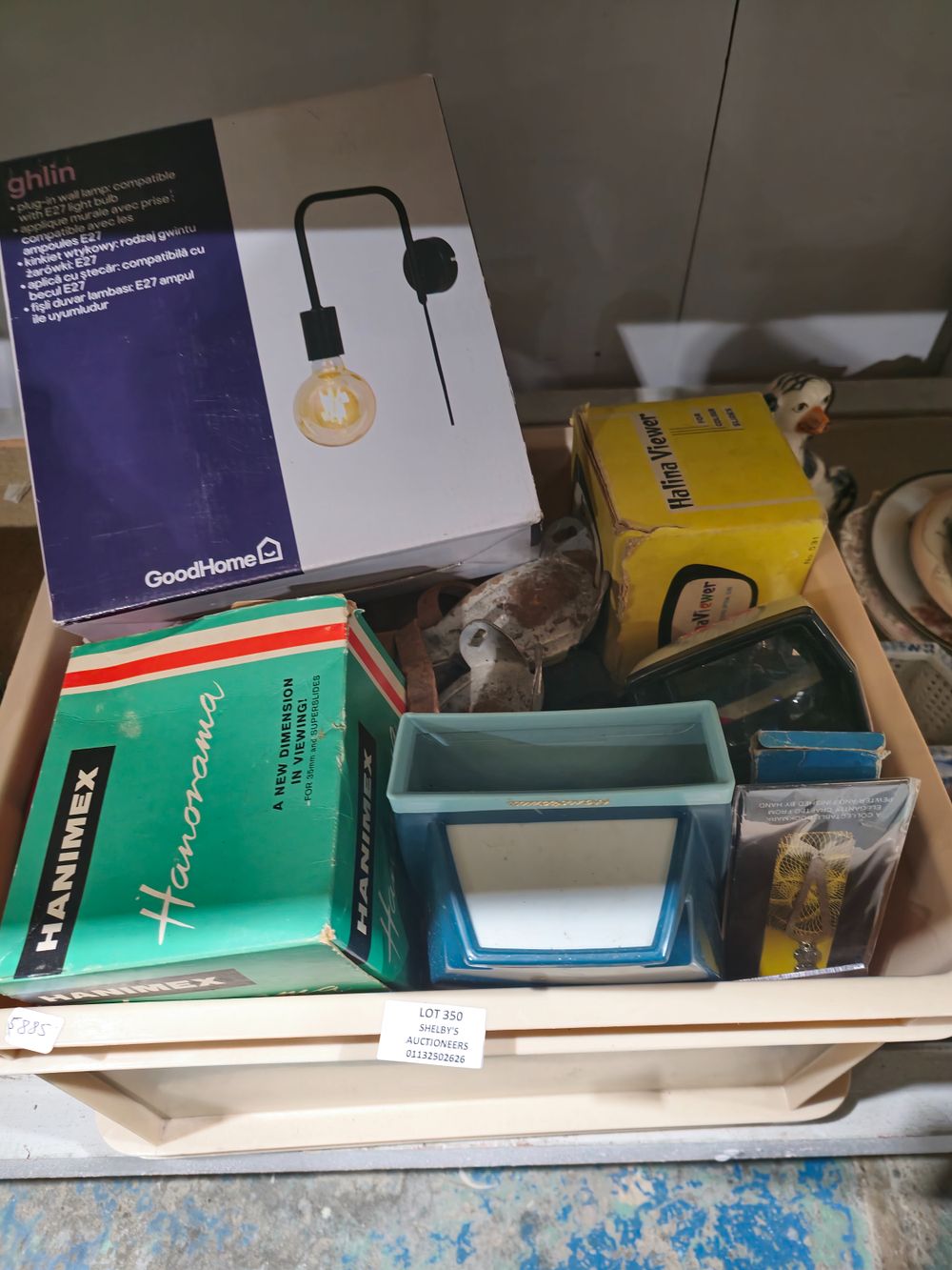 Lot 350: box containing vintage roller skates etc