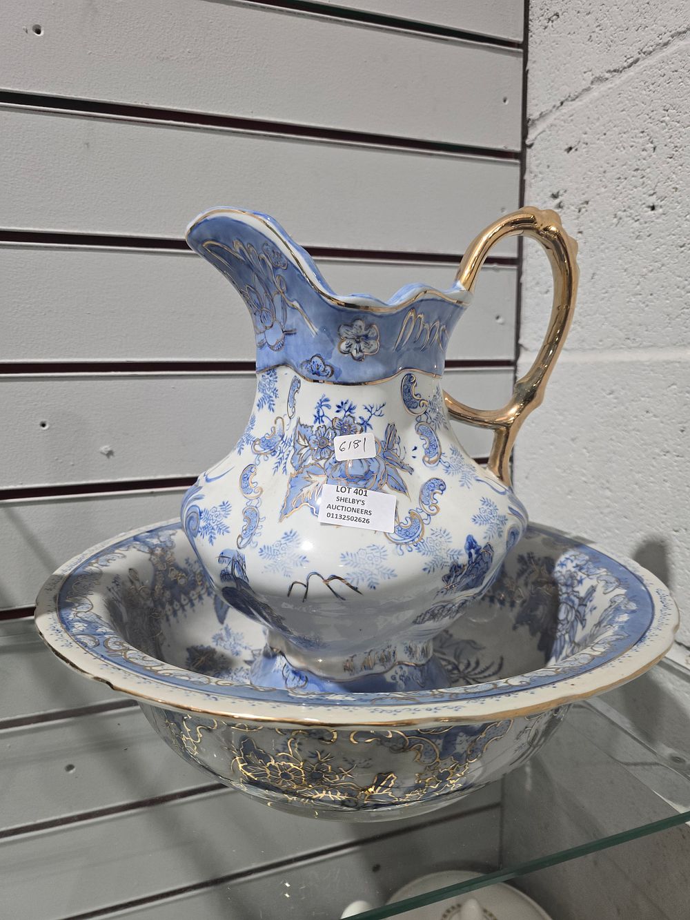 Lot 401: large blue and white ware pottery watre jug and bowl