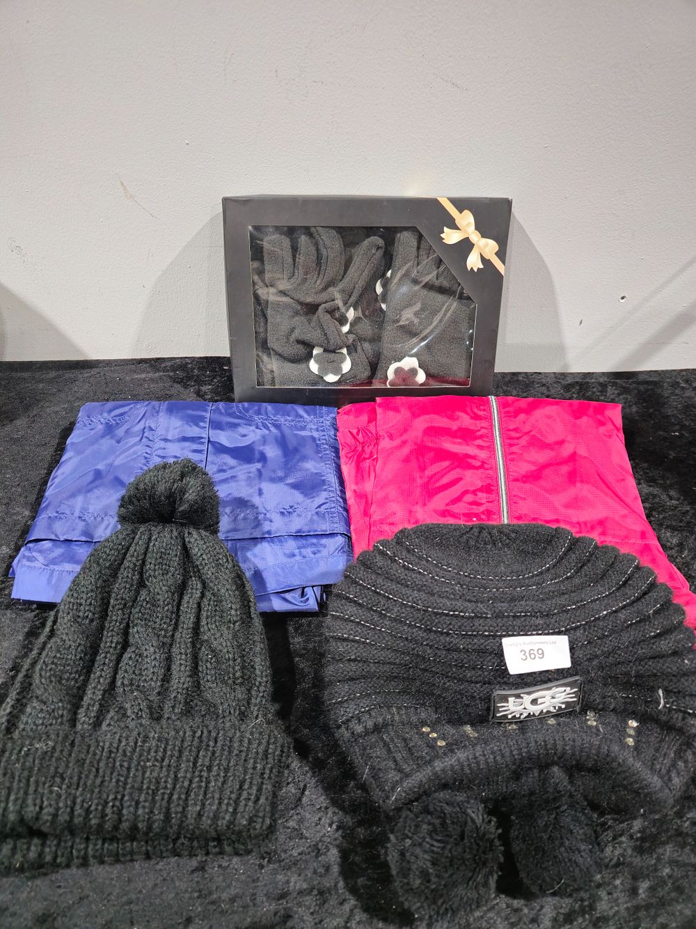 Lot 369: ladies ugg hat with 2 x water proof coats hat and scarf set etc