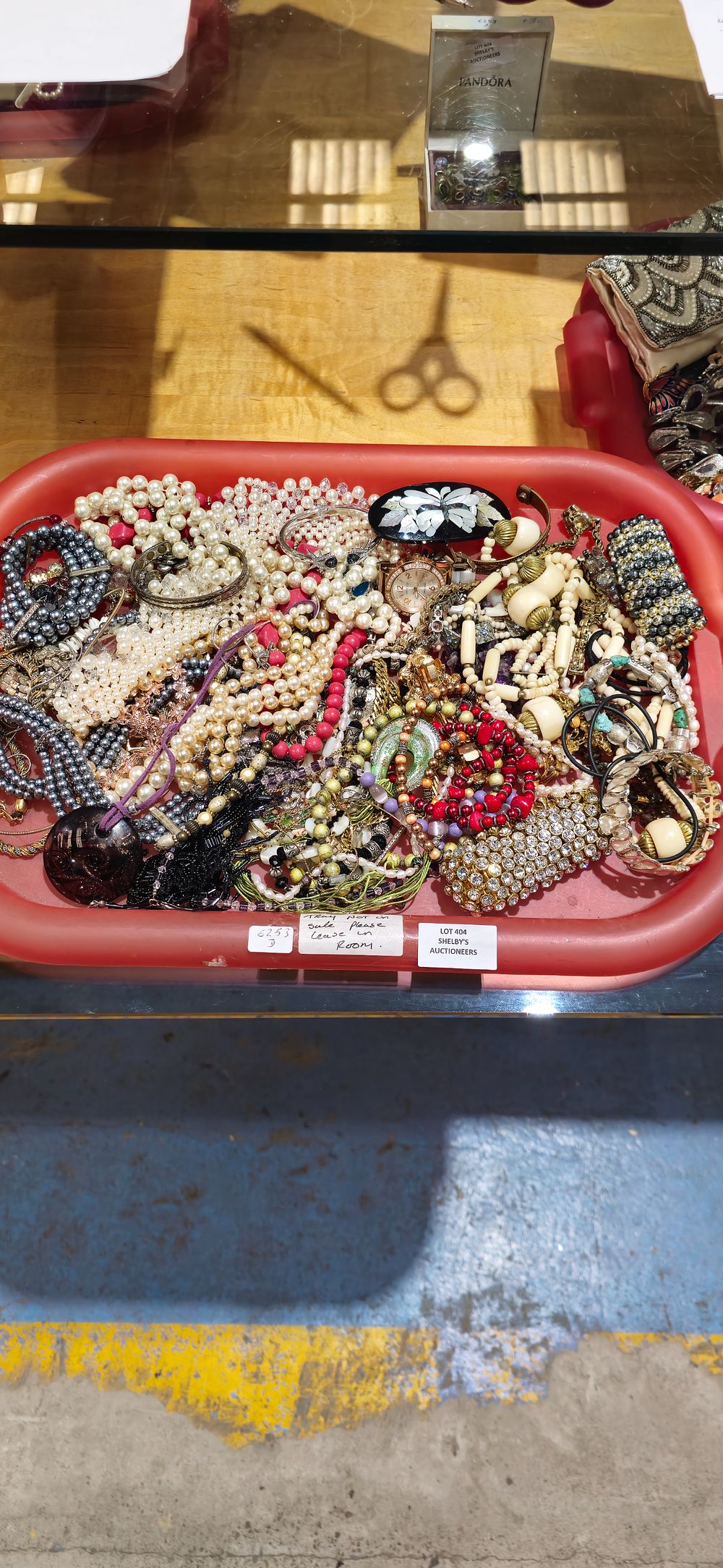Lot 404: tray containing costume jewellery ware with watch