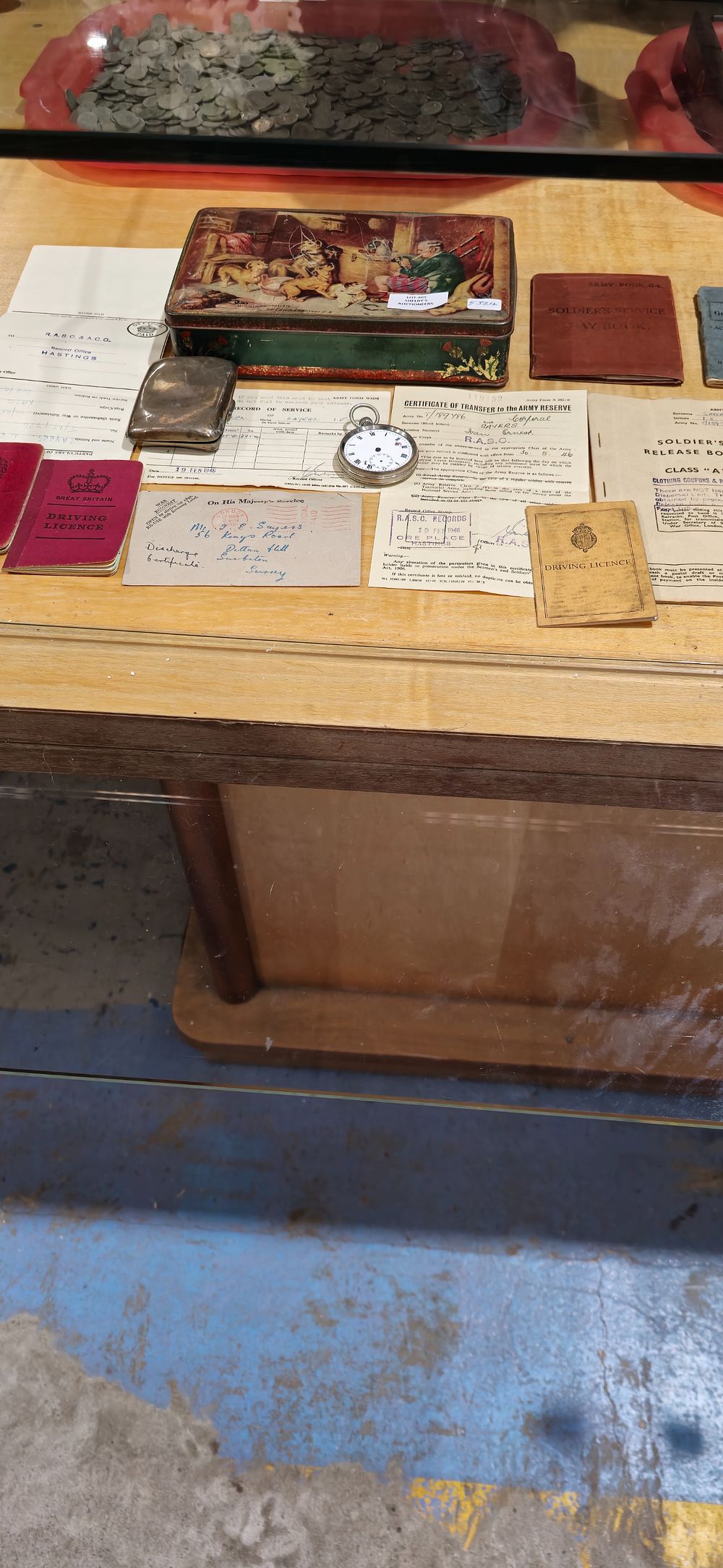 Lot 405: selection of service records for stan sayers with silver cigarette case etc