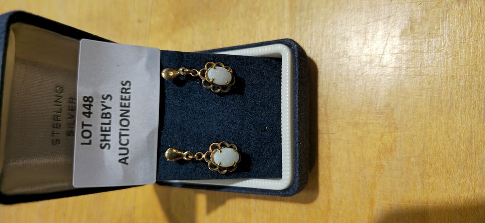 Lot 448: pair of 9ct gold opel inset earrings