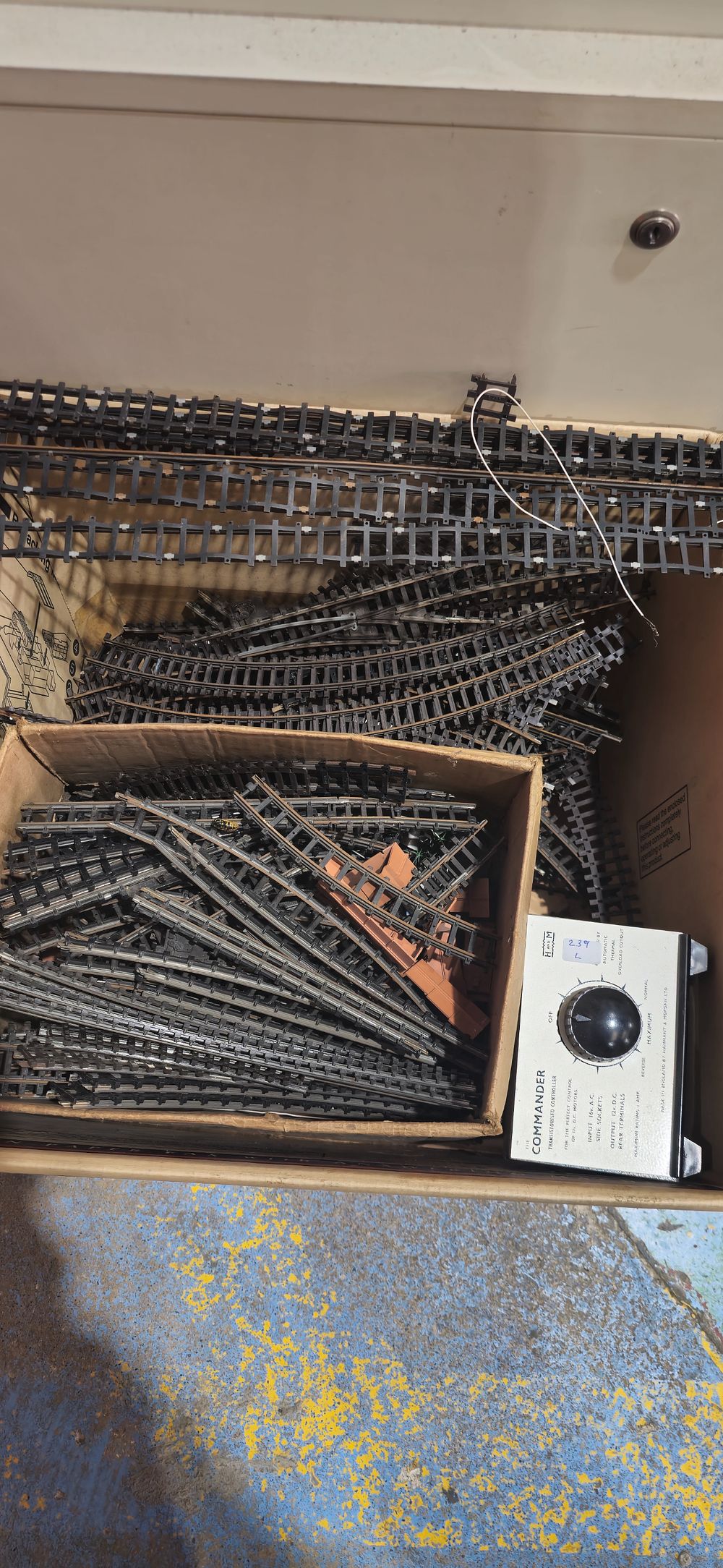 Lot 239l: selection of various 00 gauge track with buildings and trian power controlers