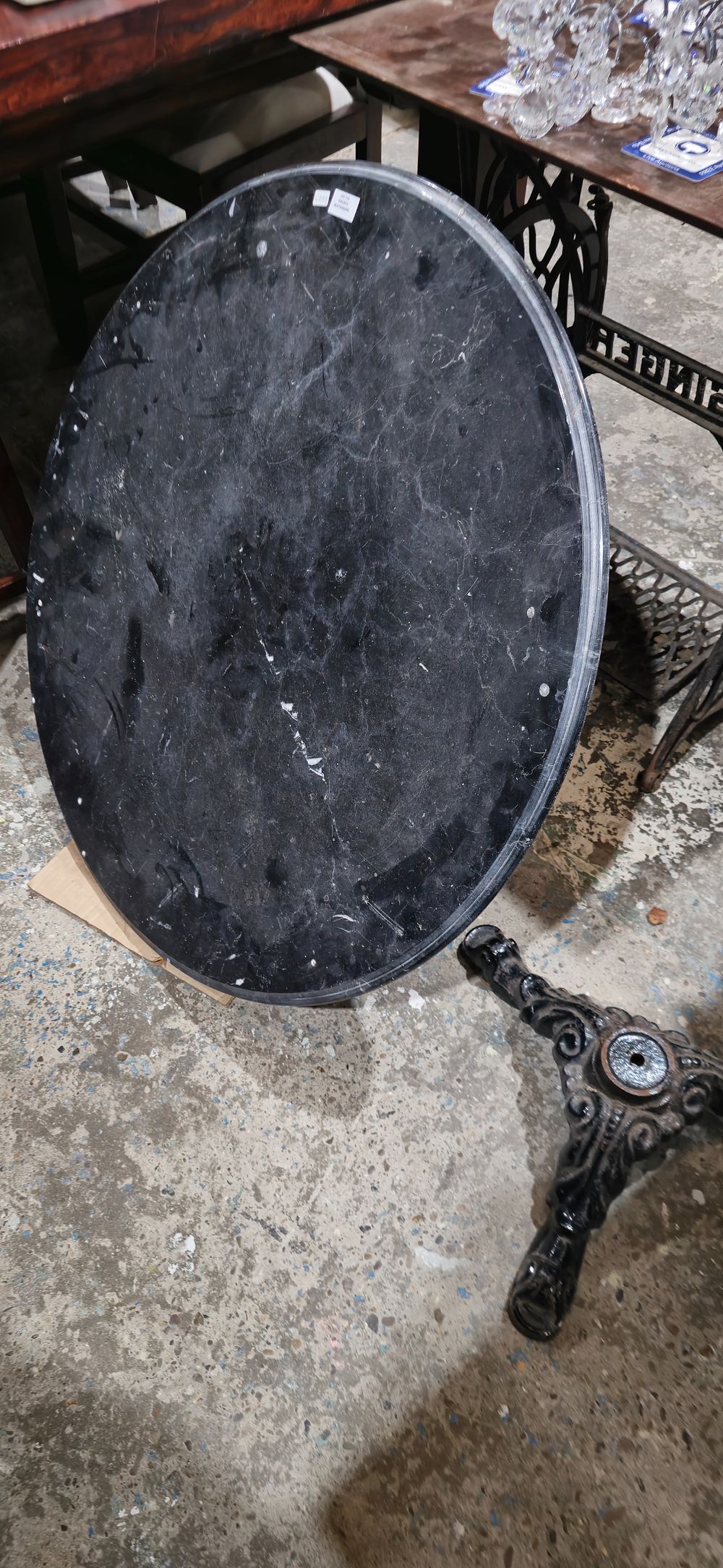 Lot 158: cast iron and marble out door table needs bolt
