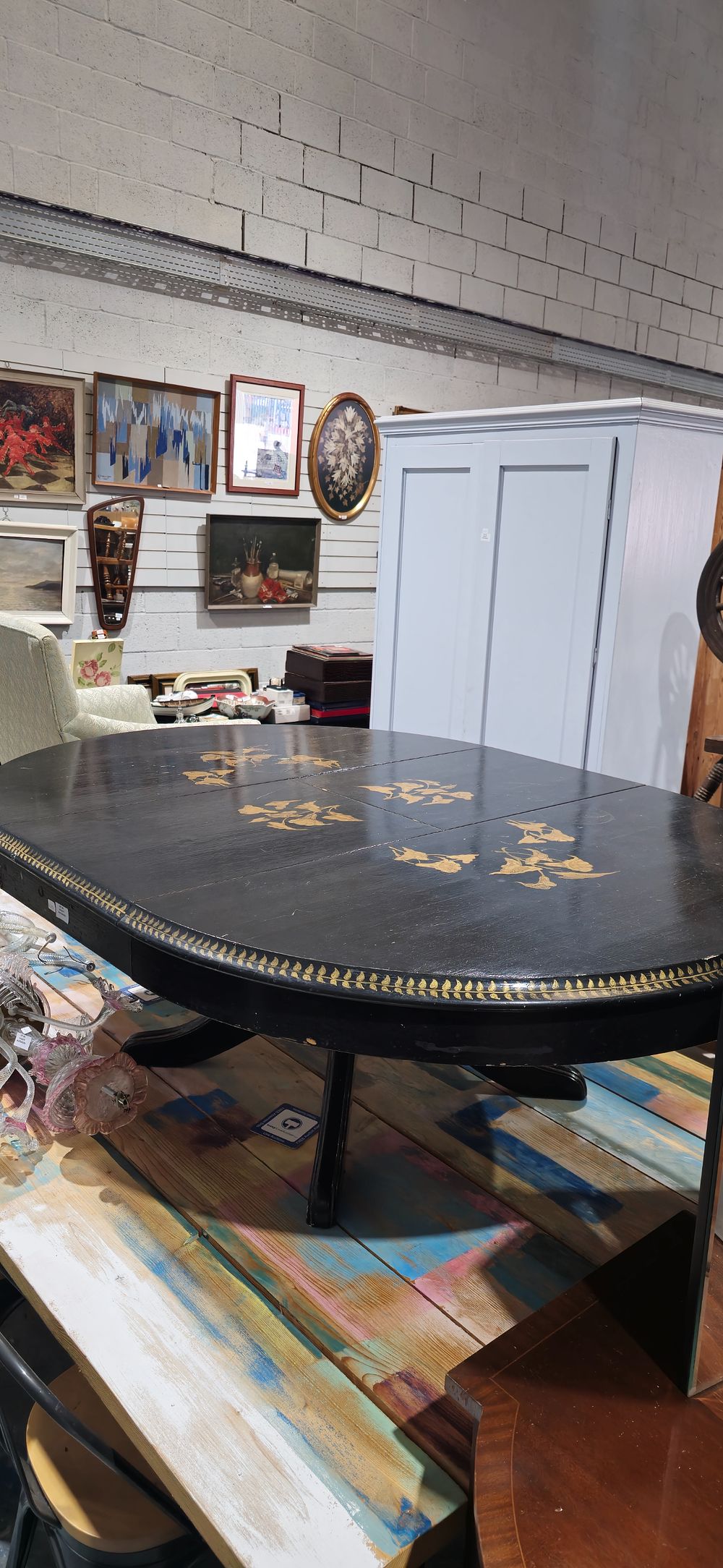 Lot 180: large black laqured gilt floral design exteding cofee table