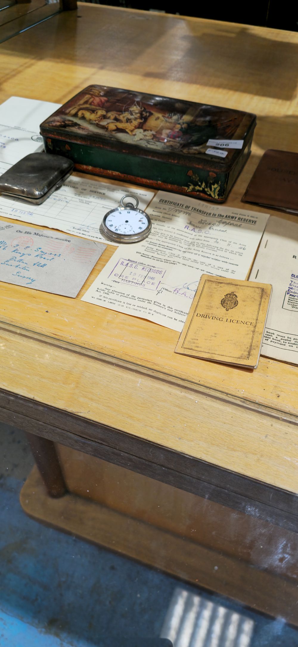 Lot 206: selection of service records for stan sayers with silver cigarette case etc