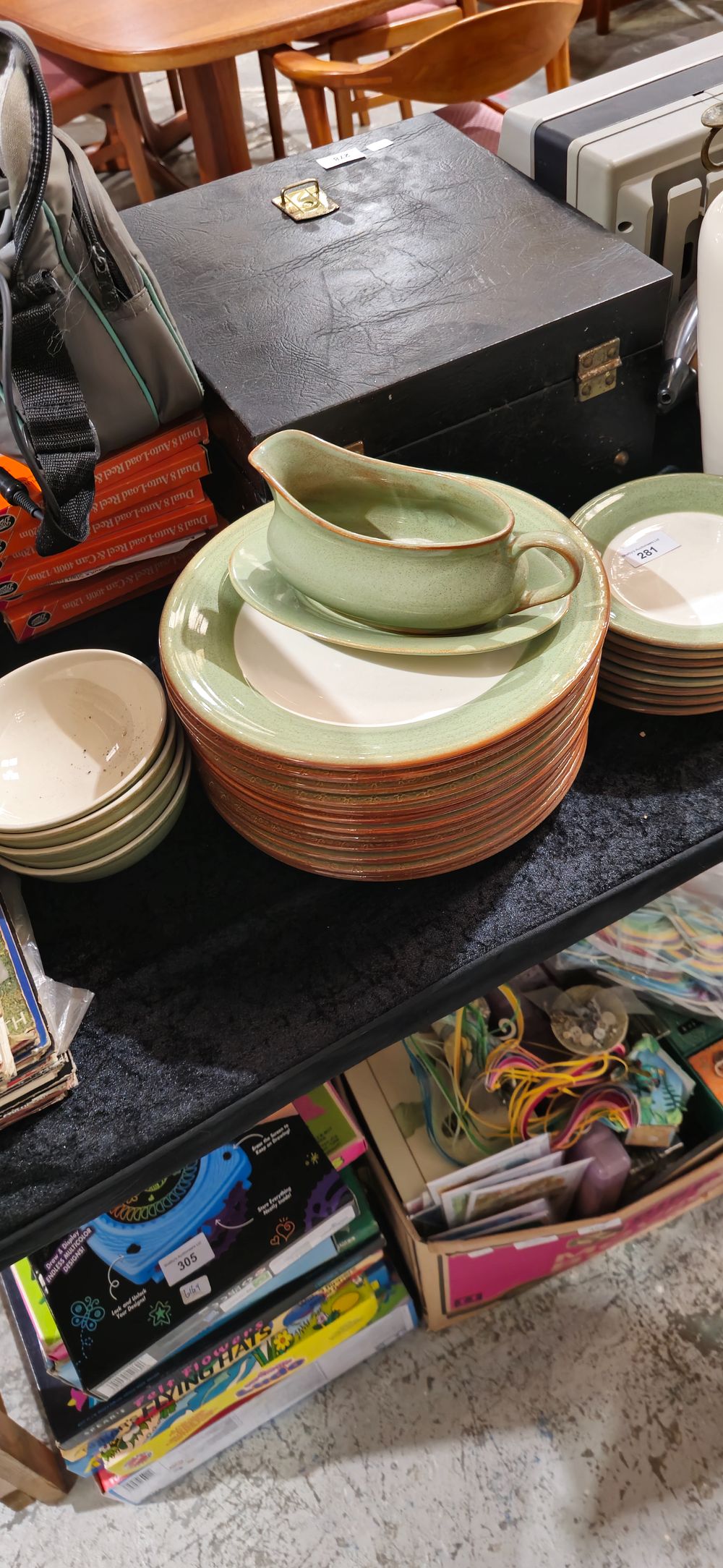 Lot 281: green and cream terracotta dinner service set