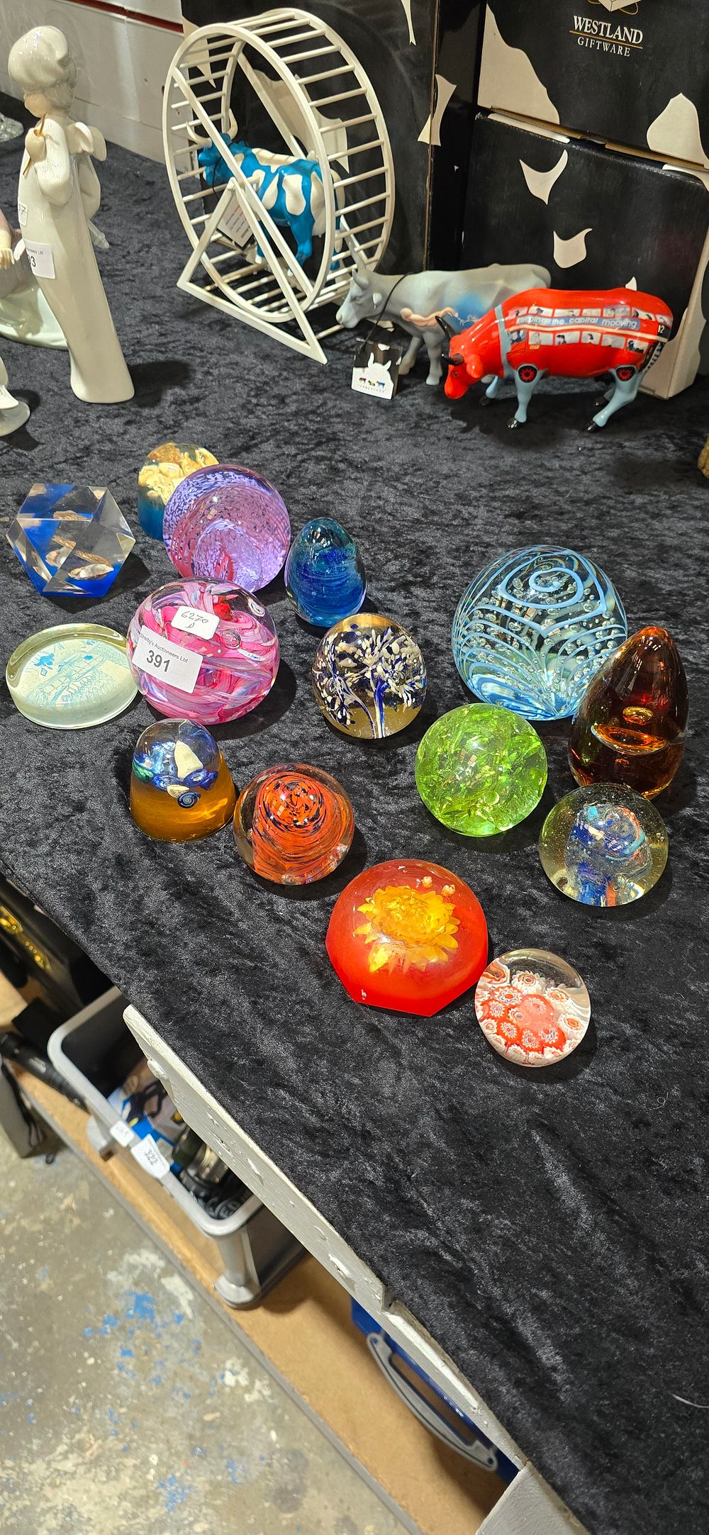 Lot 391: selection if various glass paperweights