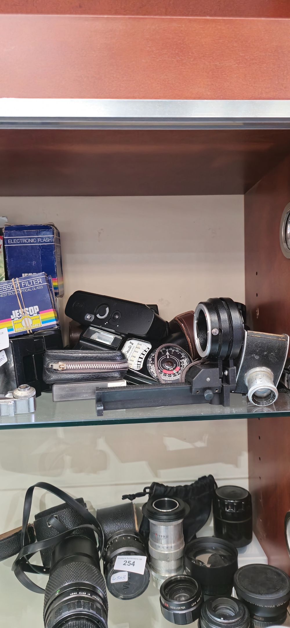 Lot 252: selection of various camera equipment items filters flashes etc