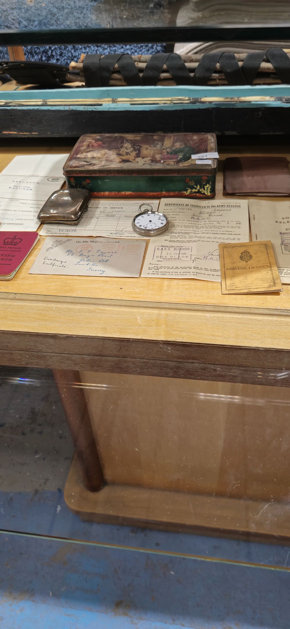 Lot 261: selection of service records for stan sayers with silver cigarette case etc