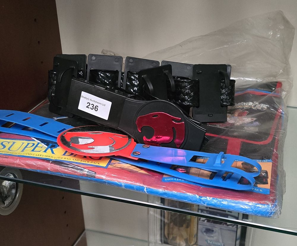 Lot 162: selection of thundercats toys belts and bag