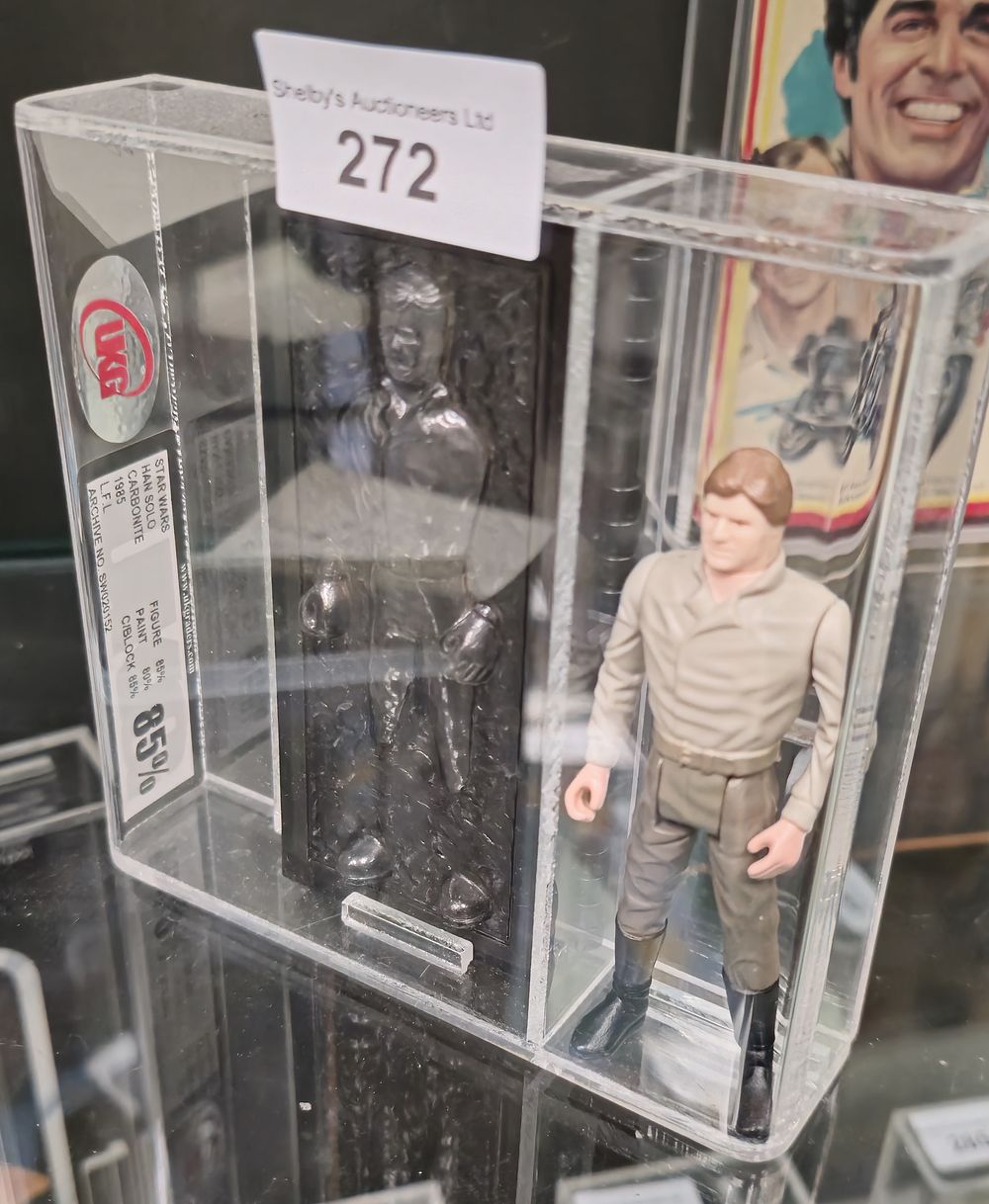 Lot 198: UKG Star Wars graded figure han solo carbonite...
