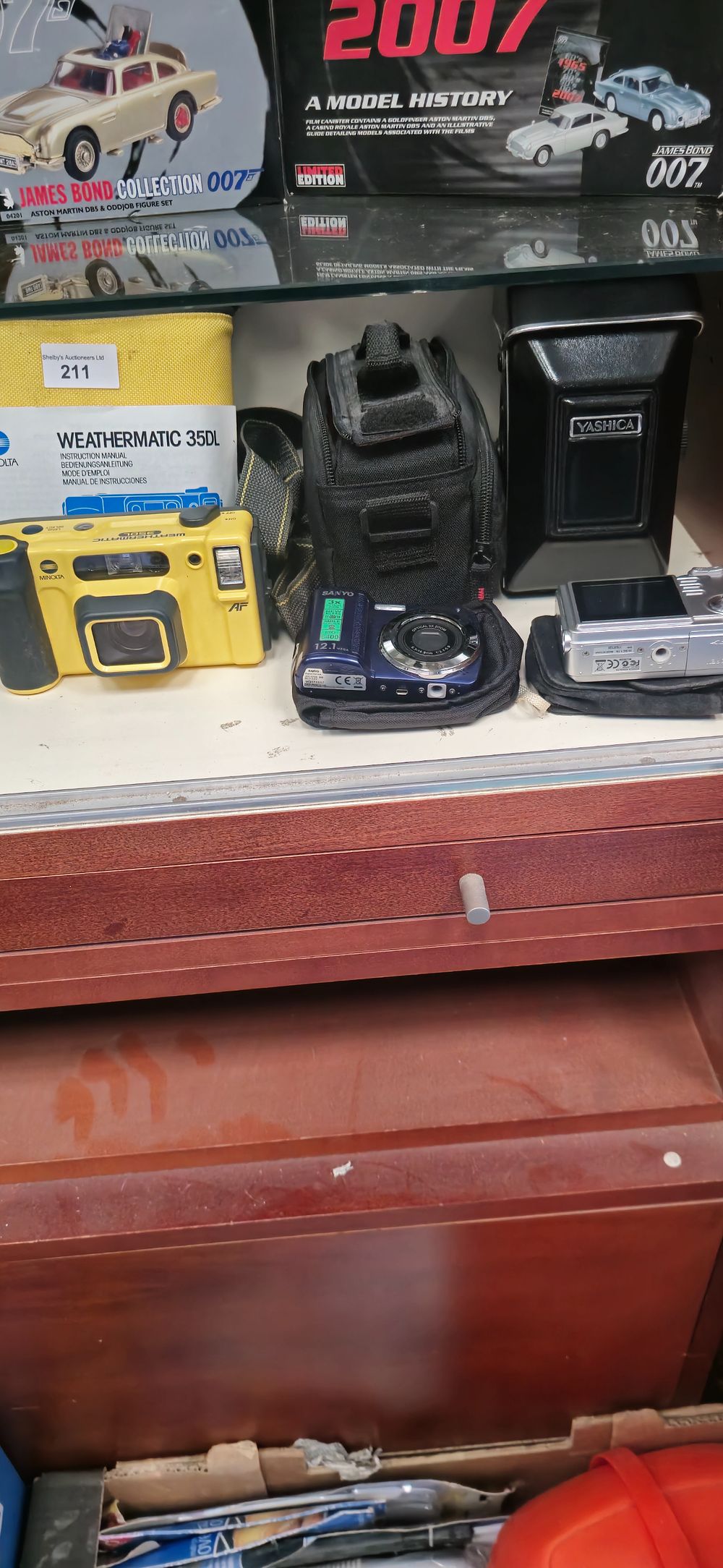 Lot 211: weather matic minolta camera with yashica camera etc