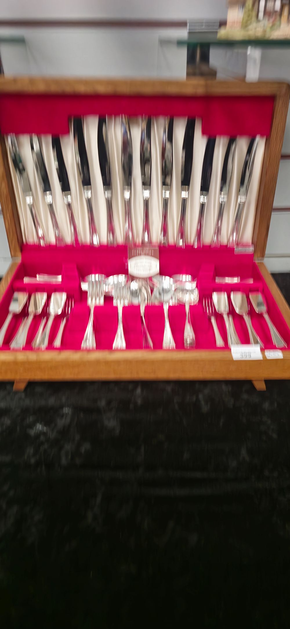 Lot 399: cutlery canteen containing insignia plate cutlery ware items