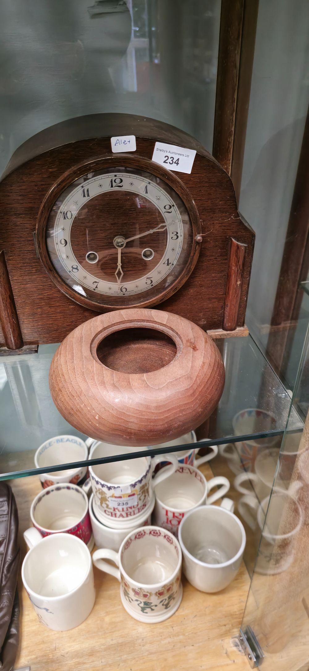 Lot 214: 1940s mantle clock with wooden wine bottle coaster