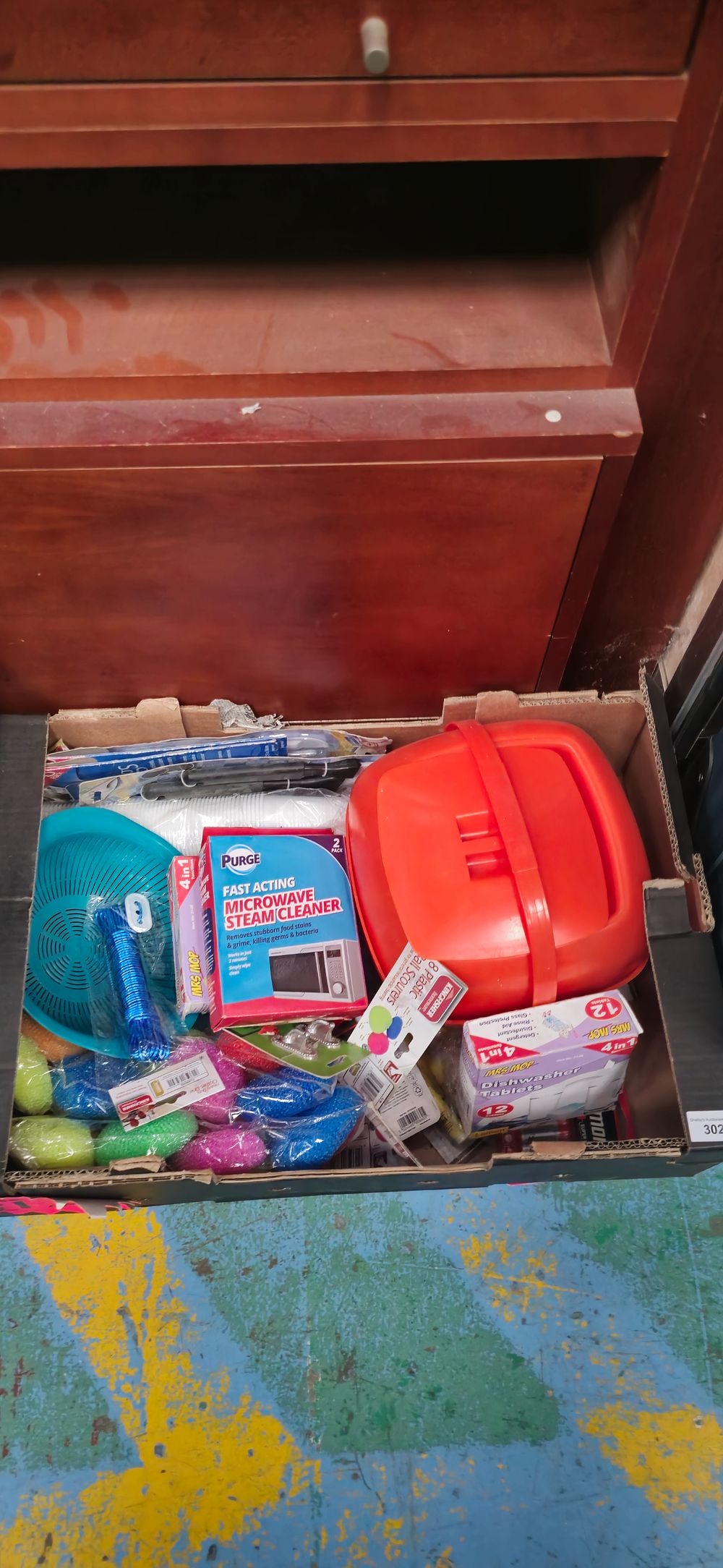Lot 197: box containing kitchen utensils dishwasher tabs and miscellaneous ware items