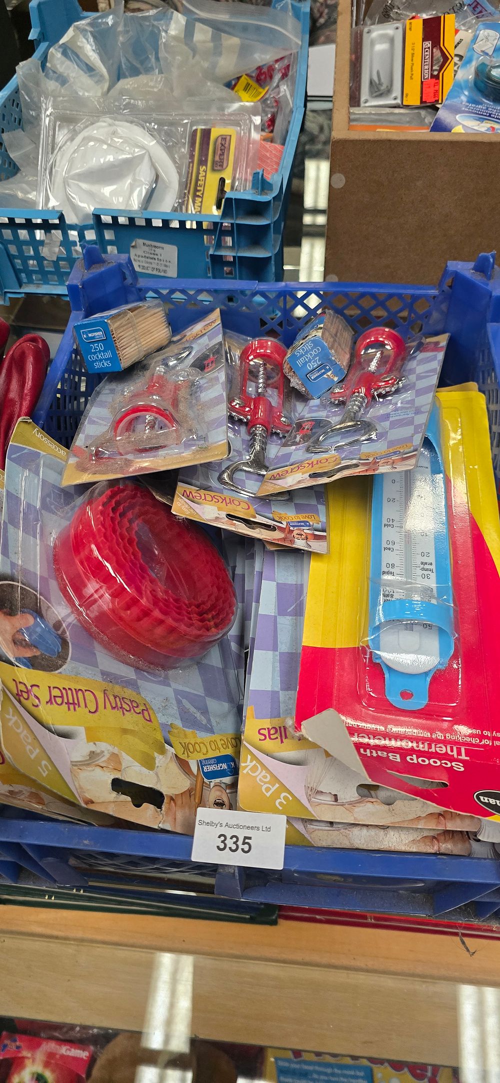 Lot 183: box containing new in package kitchen utensils corkscrews pastry cutters icing spatulas etc