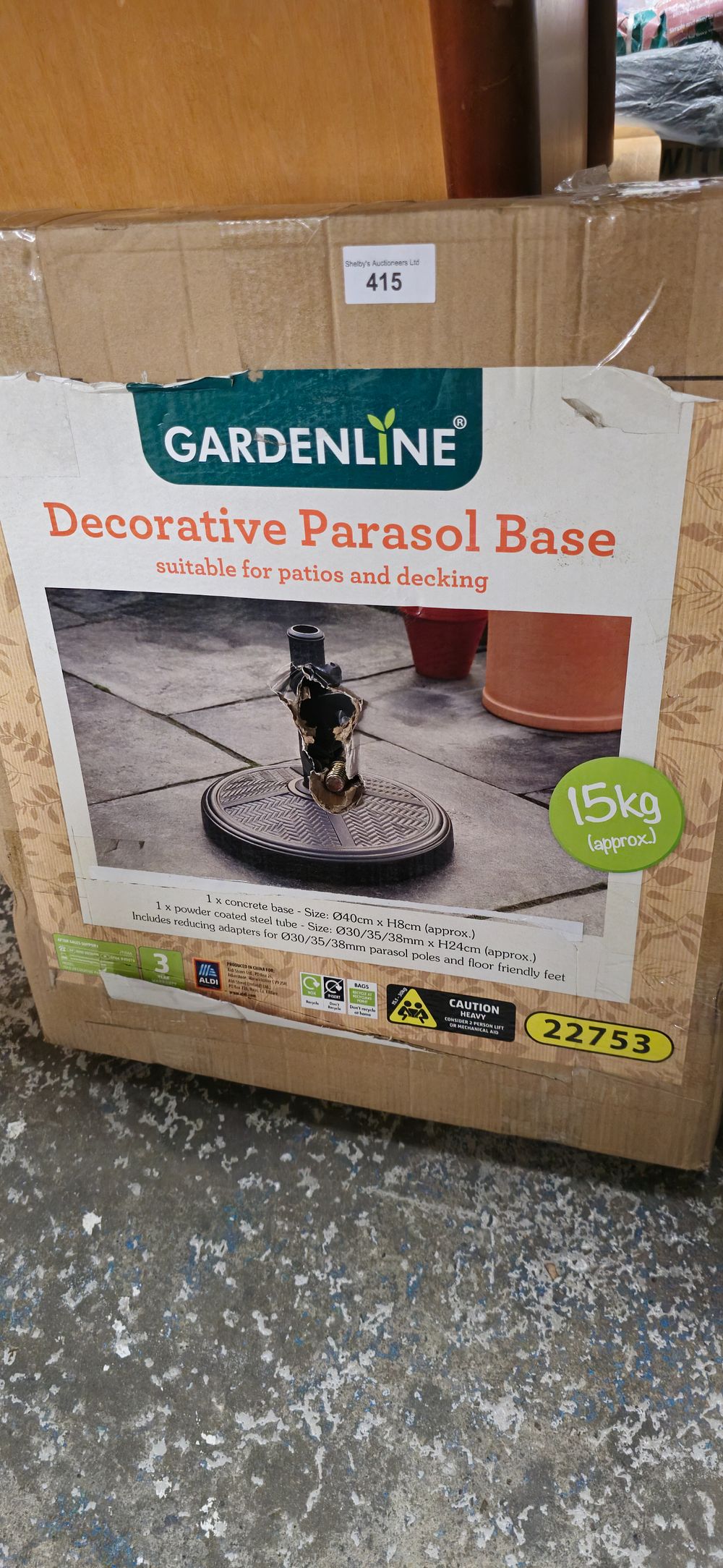 Lot 228: new in box garden line decorative metal parasol base never opened