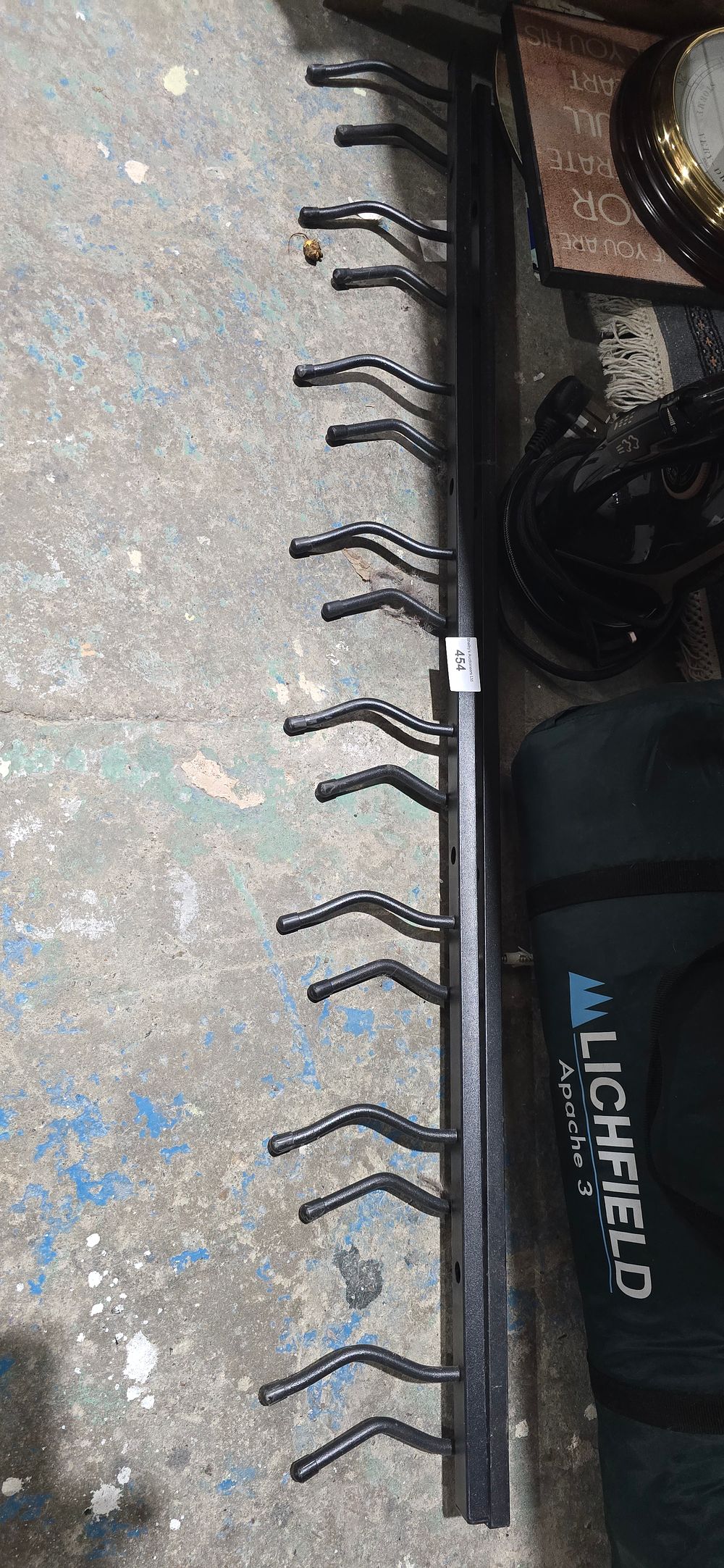Lot 207: 2 large metal coat hooks around 4ft long each wall mount