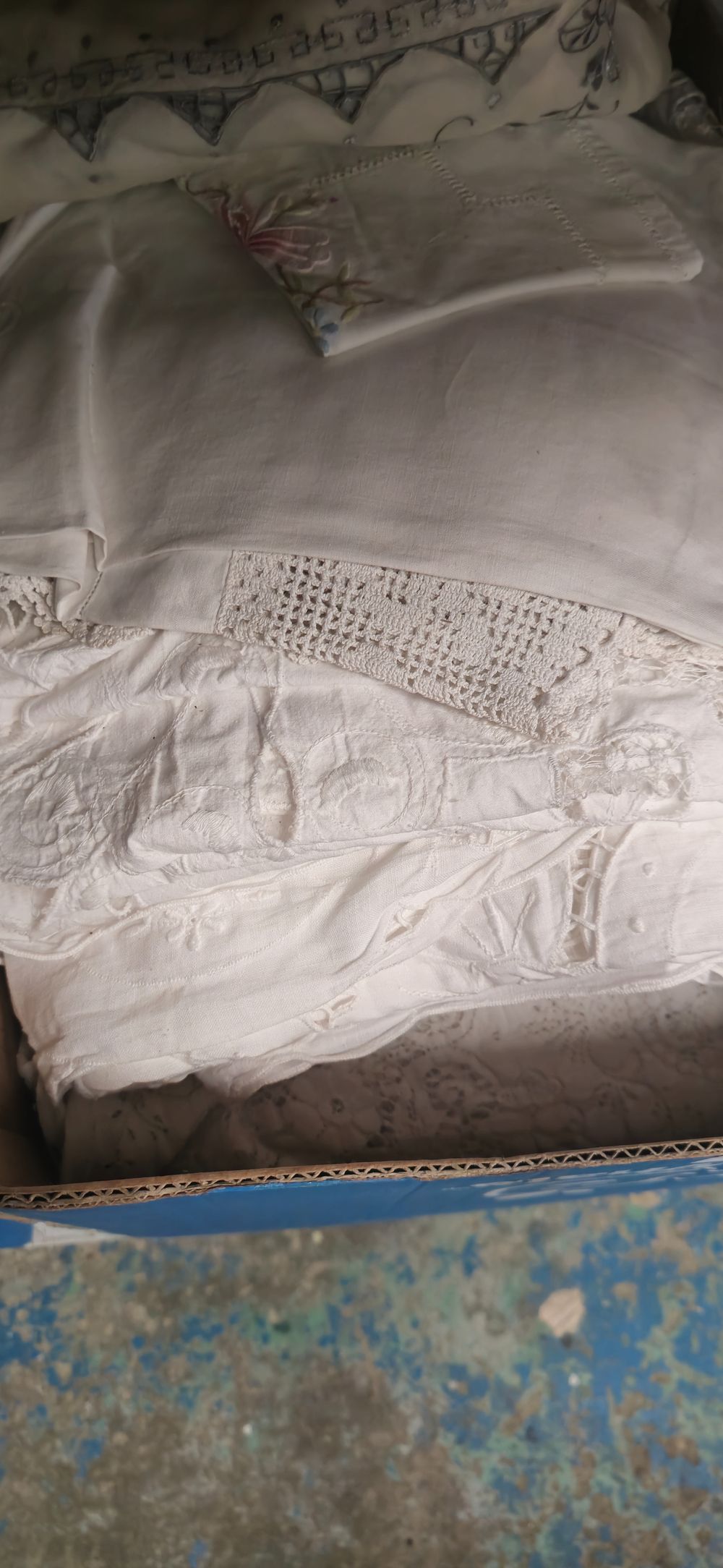 Lot 244: box containing various linen ware items table cloths etc