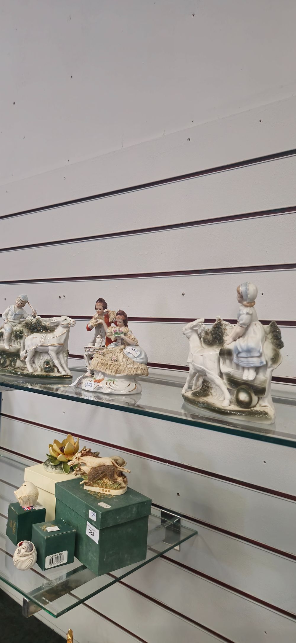 Lot 263: pair of porcelain boy and girl fireside planters with victorian style lady and gent figurine