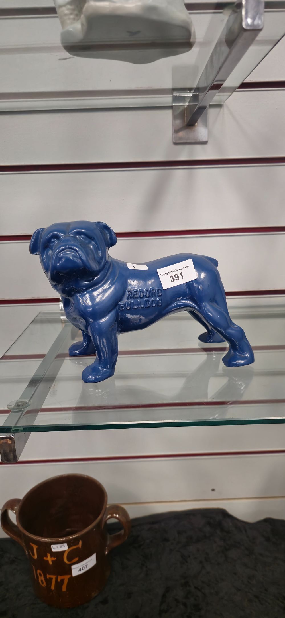 Lot 274: 1 x metal blue painted record bull dog figurine