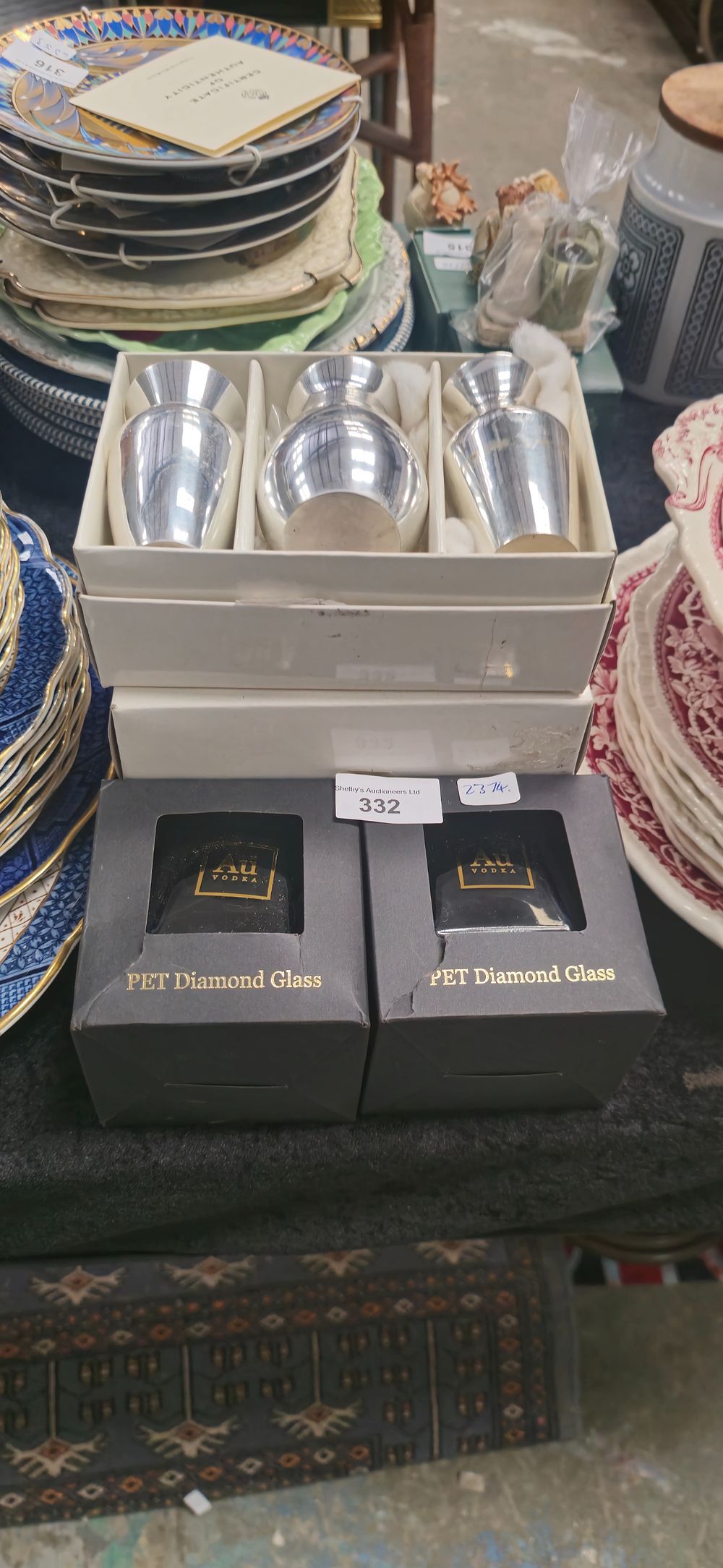 Lot 324: silver plated house of fraser bud vases with pet diamond glass