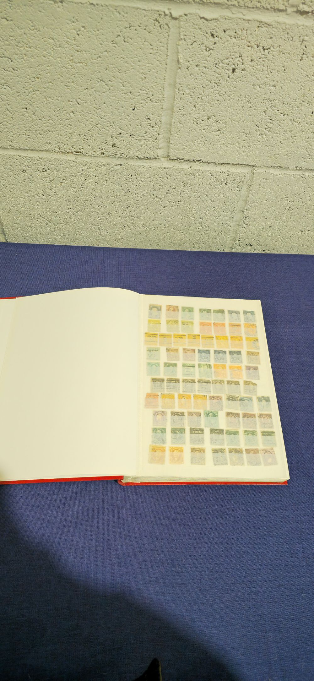Lot 152: red stamp book containing 17 pages of us postage stamps