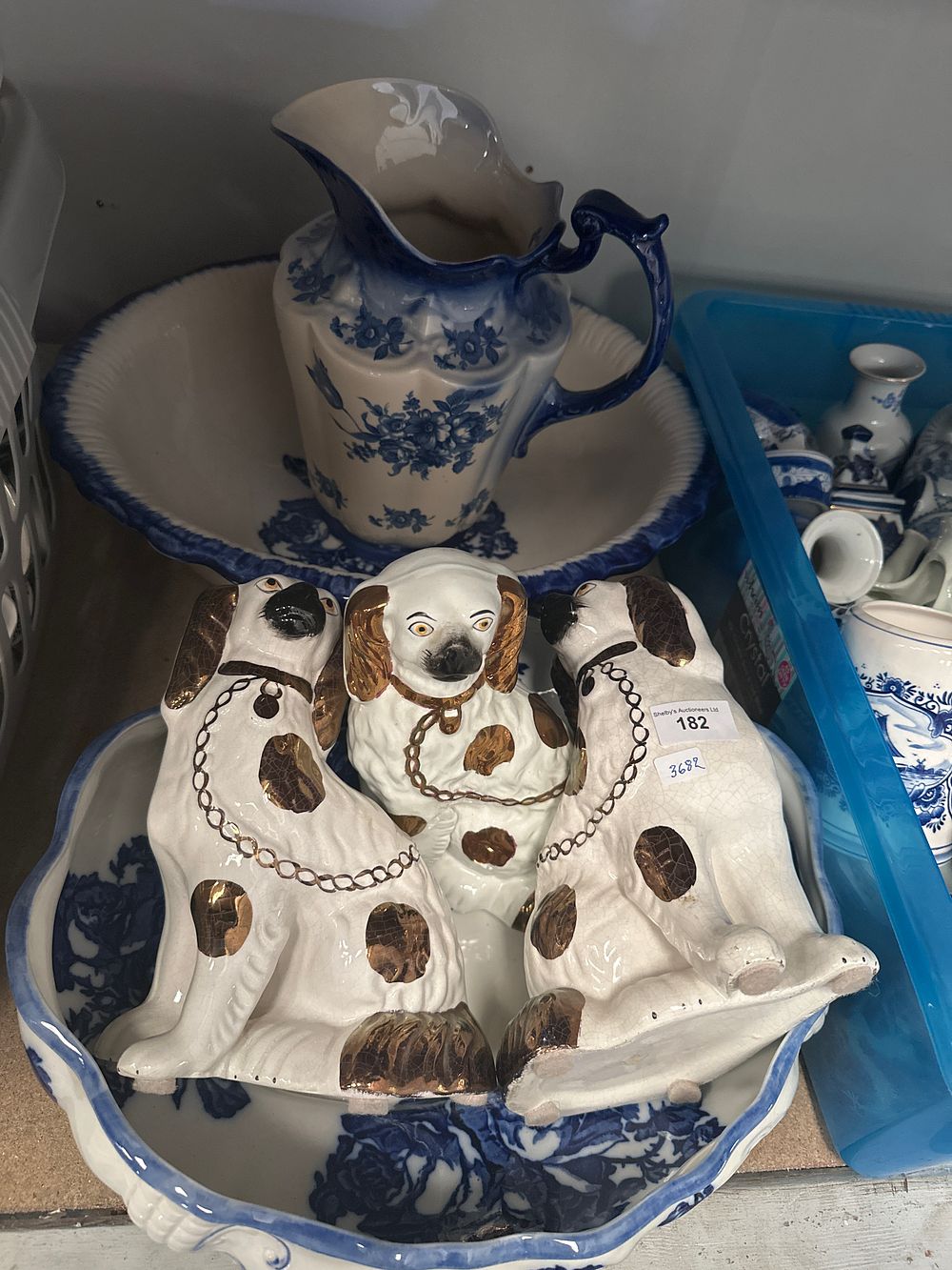 Lot 182: Large blue and white ware wash jug and bowl with Staffordshire style dogs etc