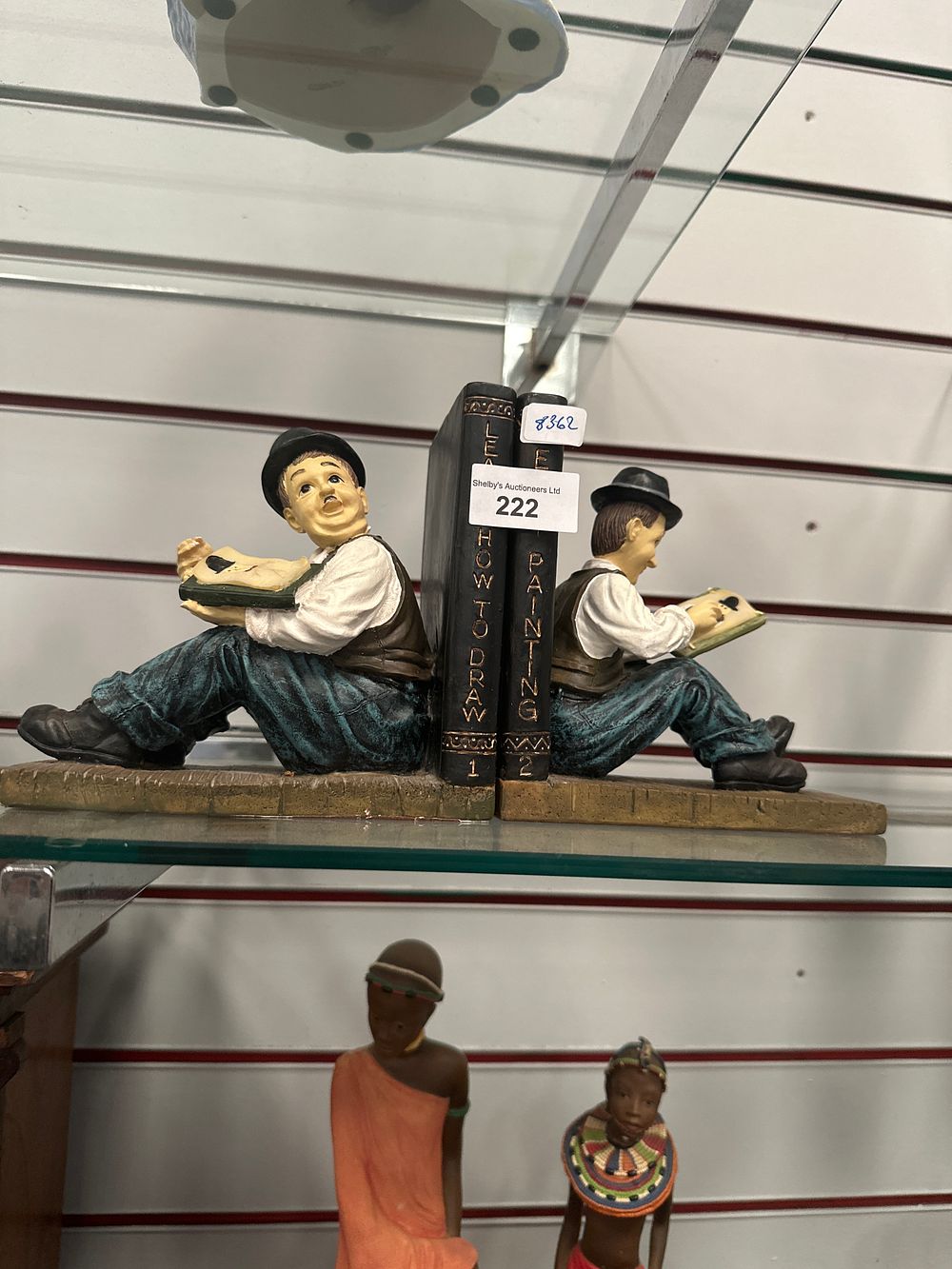 Lot 222: Pair of laurel and hardy bookends by sculptures