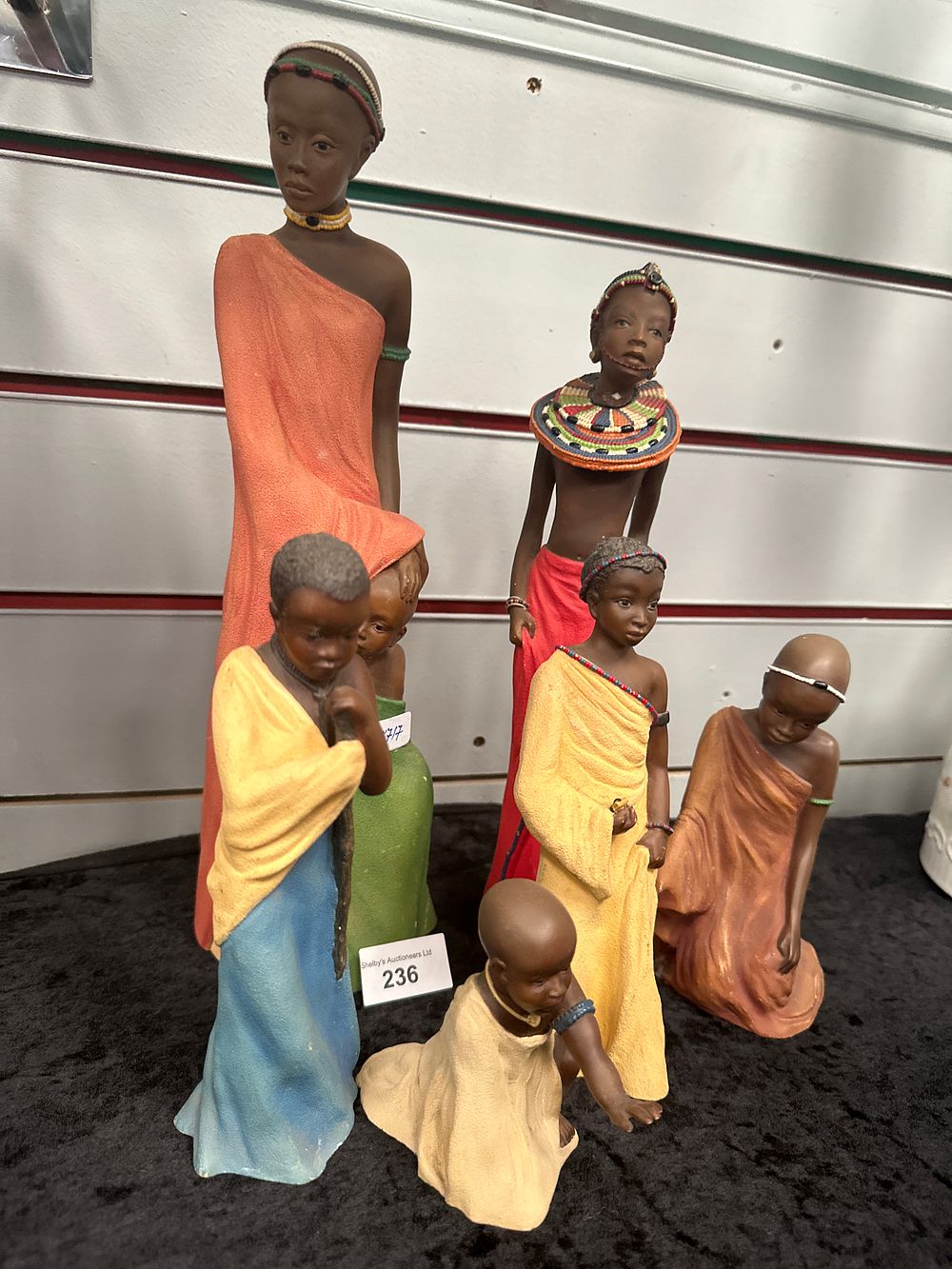 Lot 236: Selection of various African lady and child figures