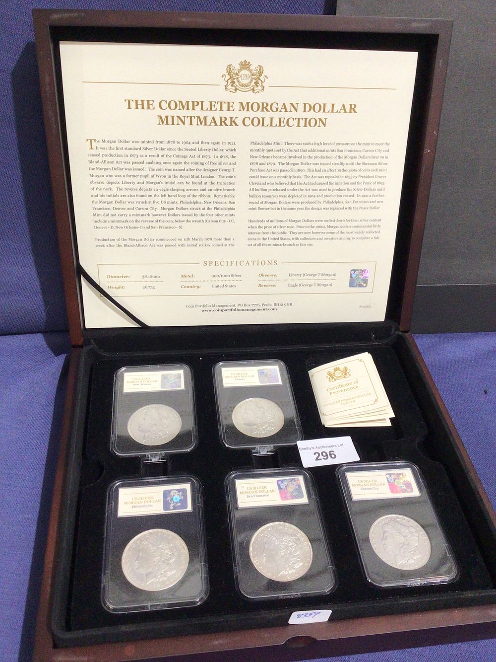 Lot 296: The complete Morgan dollar mintmark 5 Morgan dollar set with certificates all via coinport folio