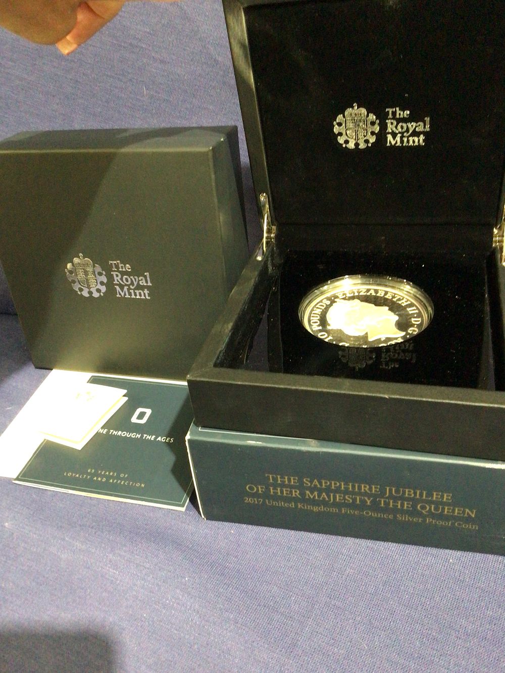 Lot 290: The royal mint the sapphire jubilee of her majesty the Queen 2017 United Kingdom five oz silver proof coin complete in box