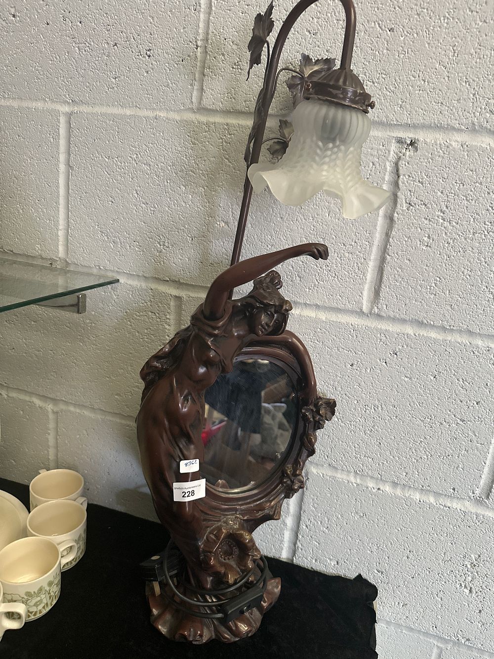 Lot 228: Large resin lady figurine lamp with integral mirror