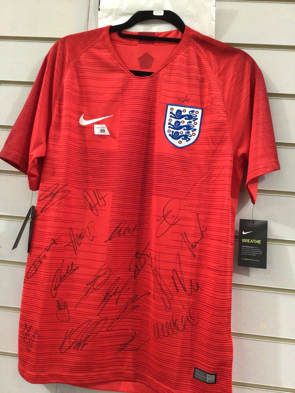 Lot 99: Signed new medium England football shirt with tags