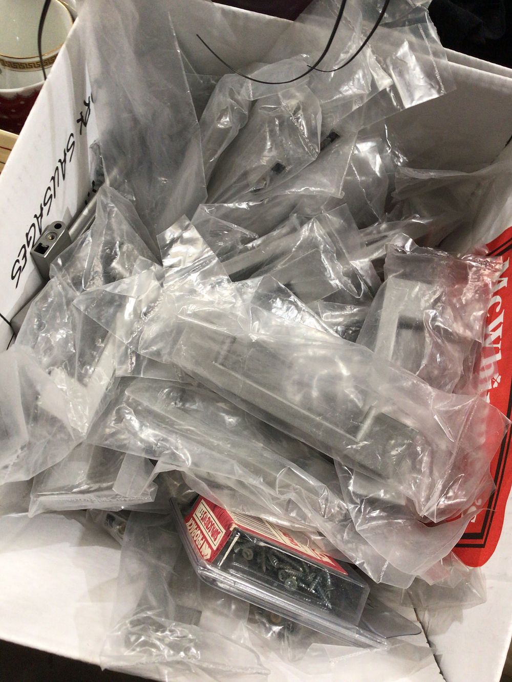 Lot 216: Box containing cupboard door handles