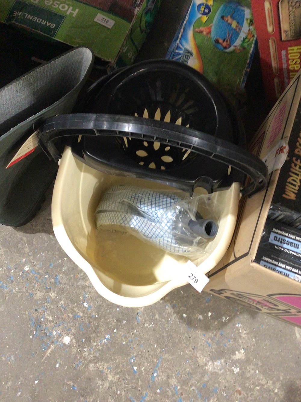 Lot 279: New mop bucket cream plastic with new mop...
