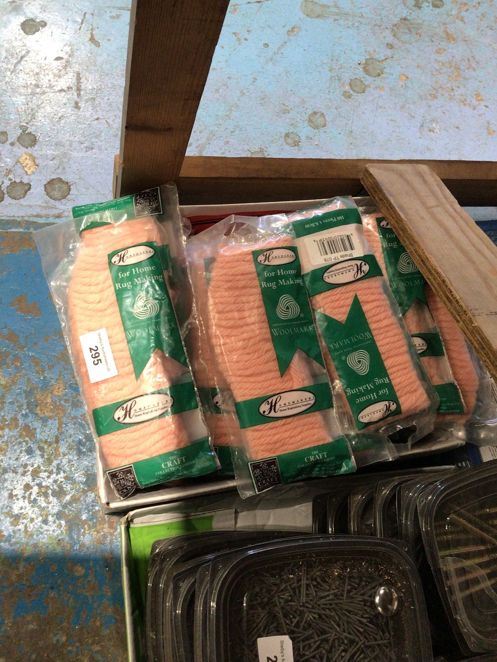 Lot 295: Box containing wool mark rug making wool in...
