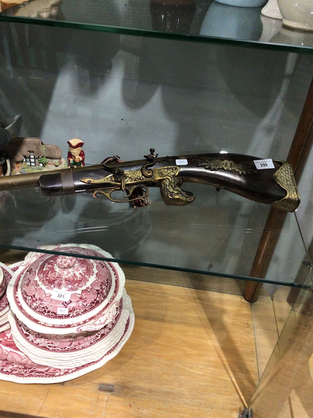 Lot 299: Reproduction flint lock wall hanging gun eagle design...