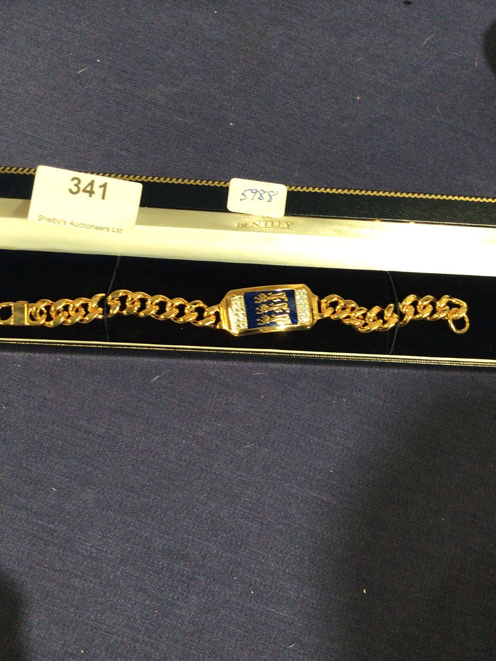 Lot 341: Gold plated England bracelet