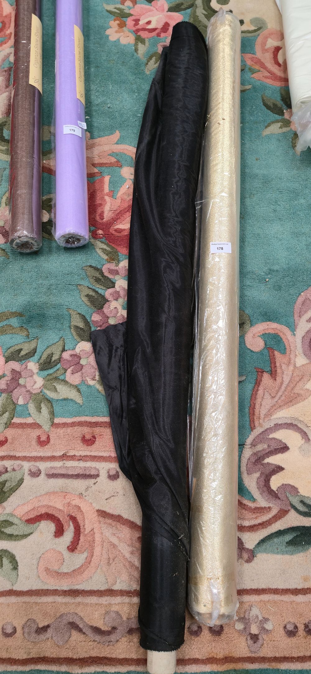 Lot 178: One roll of gold and white metal material...
