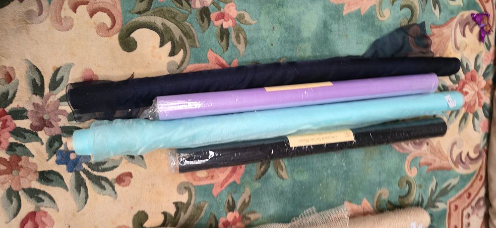 Lot 183: Three rolls of organza, sheer material, lilac, turquoise...
