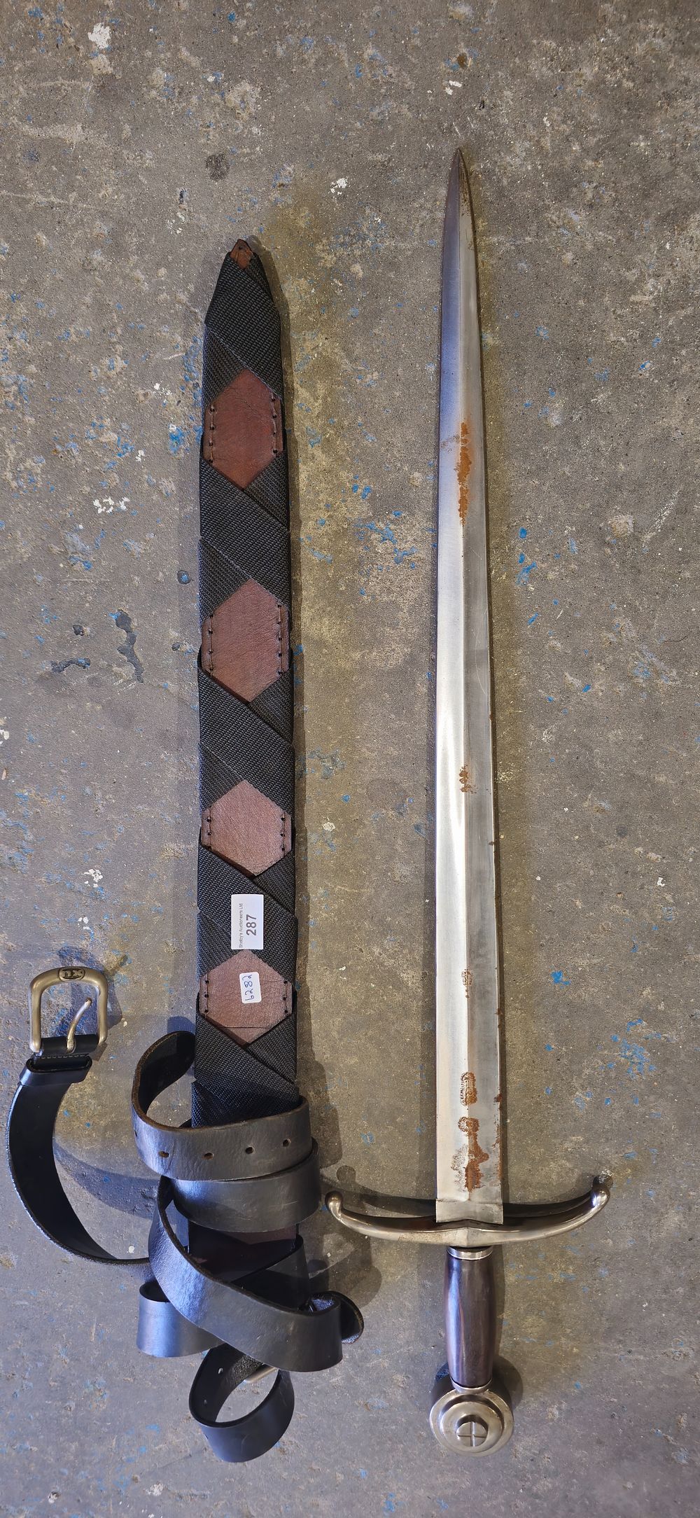 Lot 198: ornamental sword in leather and canvas sheath