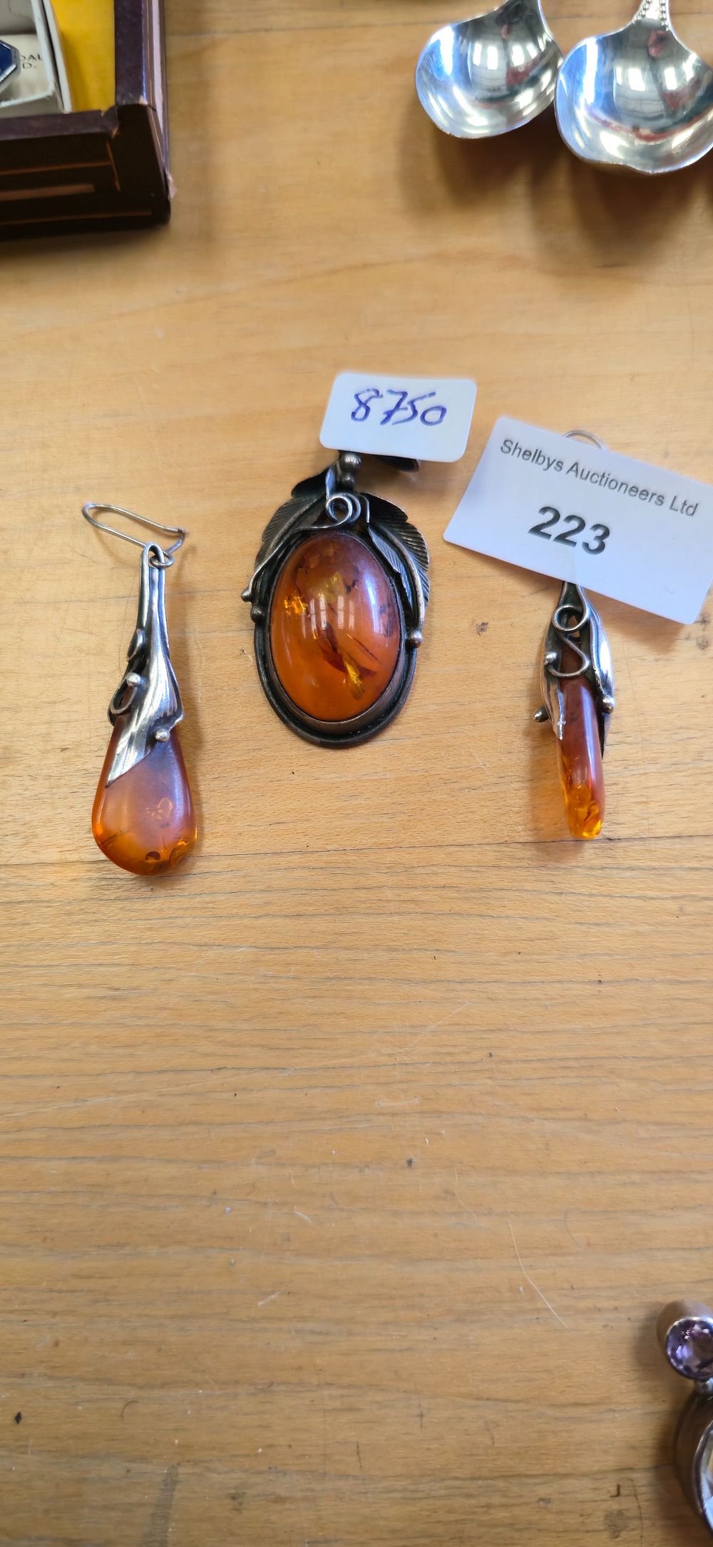 Lot 223: Pair of silver and amber insert earrings with...